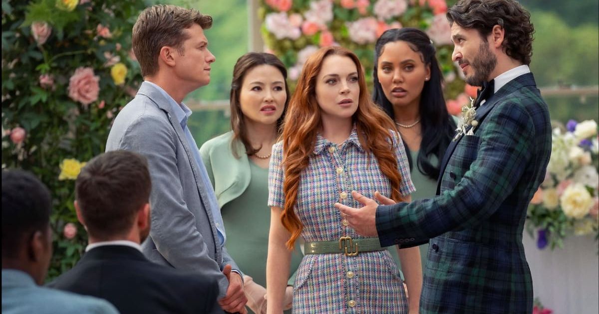 Lindsay Lohan, Ed Speleers, Elizabeth Tan, Ayesha Curry, and Alexander Vlahos in a still from 'Irish Wish' (@Netflix)