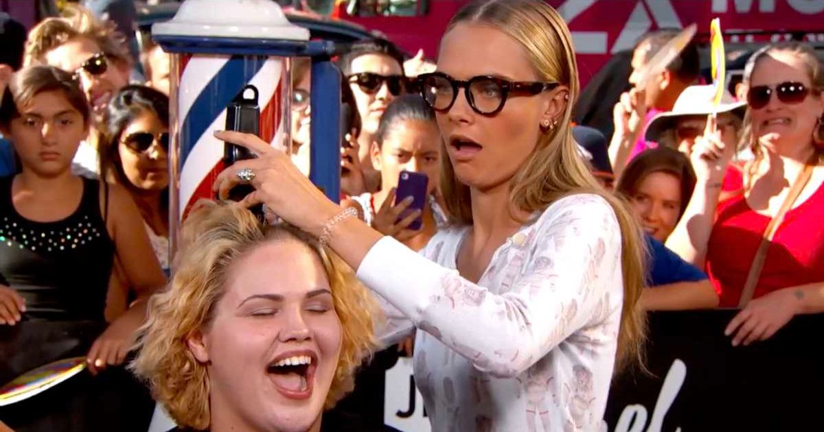 A screenshot of Cara Delevingne giving a haircut to a woman on 'Jimmy Kimmel Live!' (Cover Image Source: YouTube | Jimmy Kimmel Live)