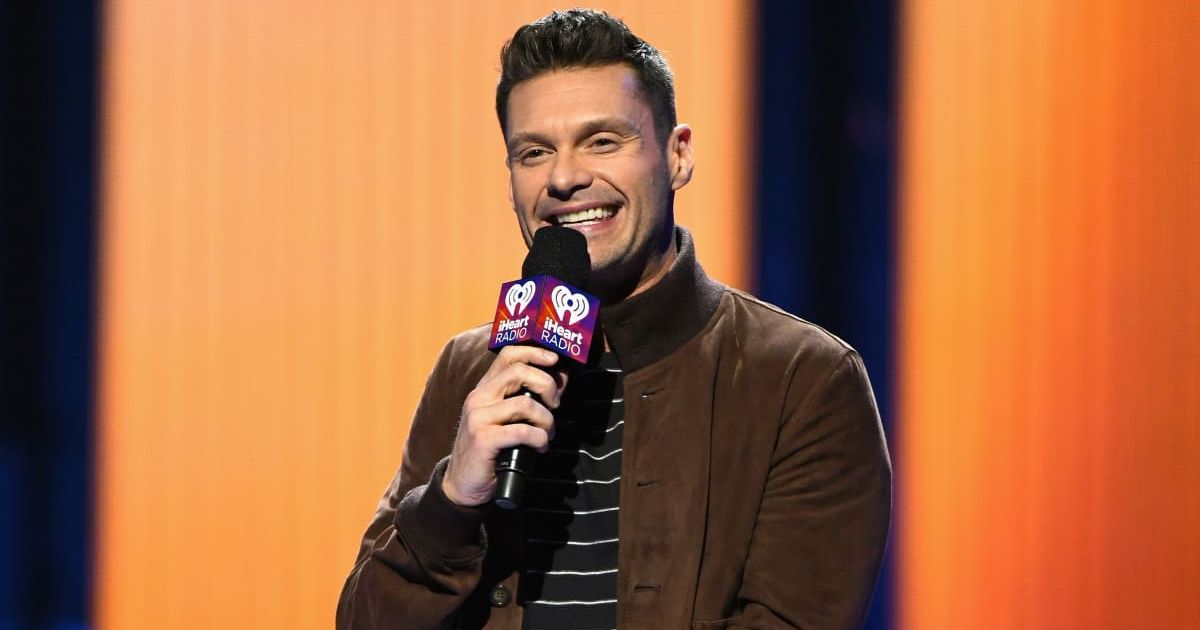 Host Ryan Seacrest speaks onstage at the 2016 iHeartRadio Music Festival at T-Mobile Arena on September 24, 2016 in Las Vegas, Nevada. (Cover image source: Photo by Ethan Miller/WireImage | Getty Images)
