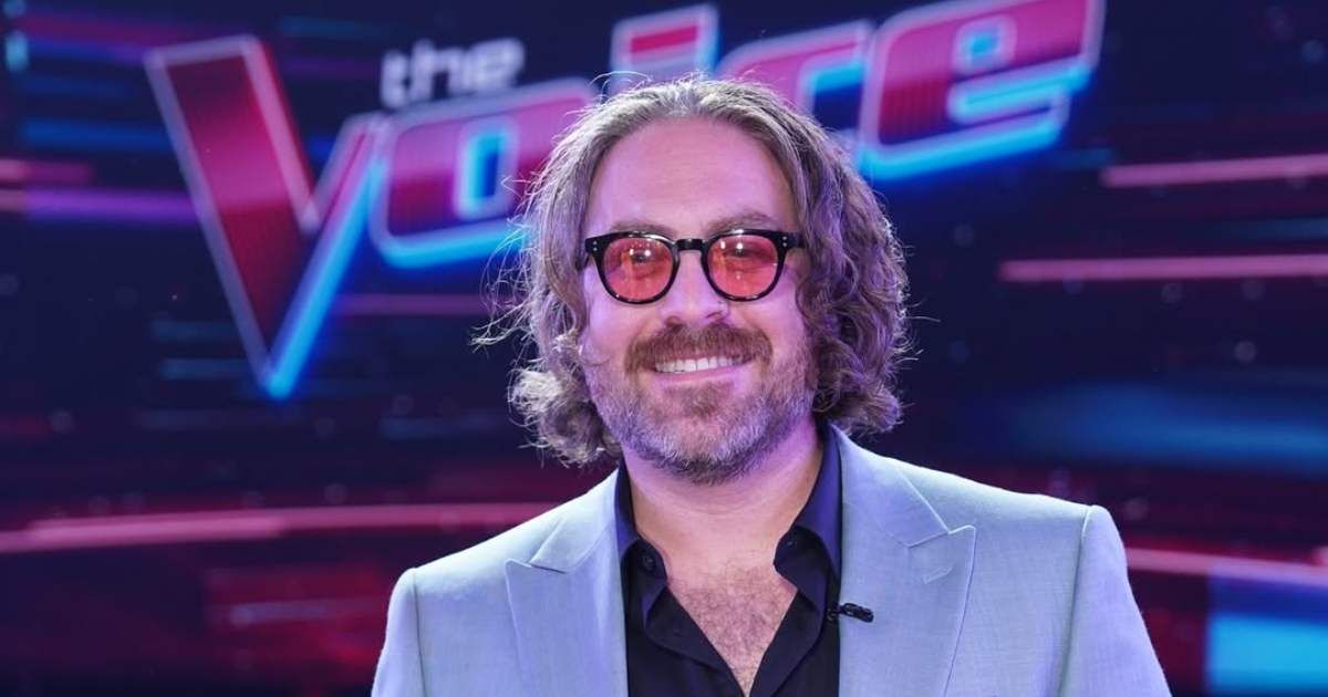 'The Voice' season 23 winner, Adam David, poses on the sets of the show. (Cover Image Source: Instagram | @adamdavidofficial)
