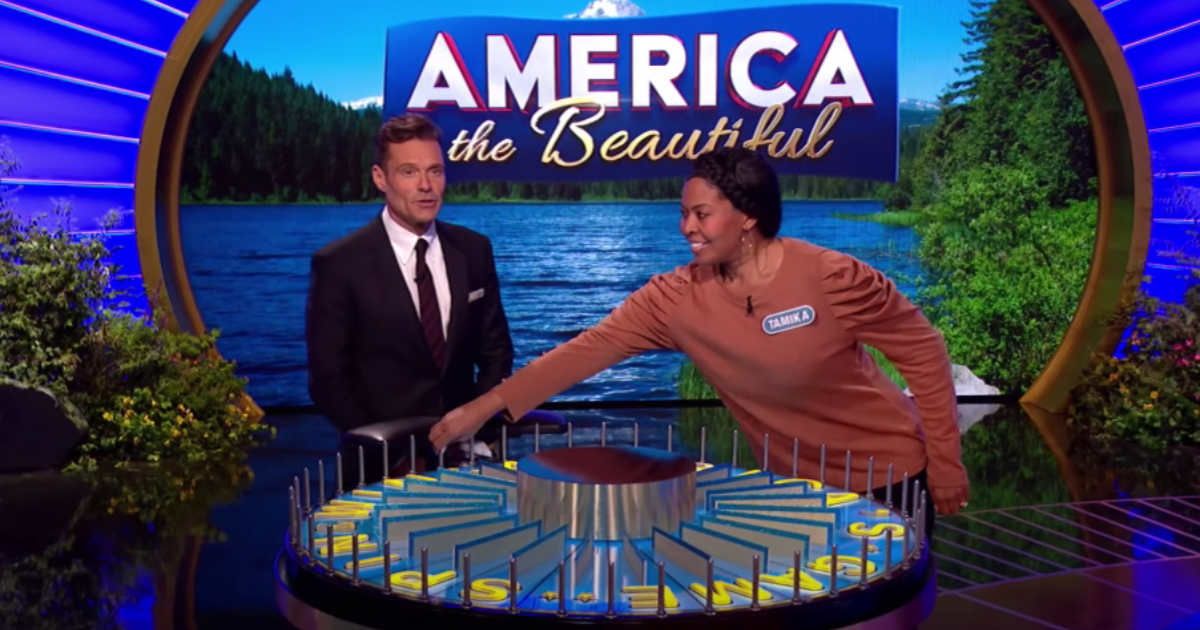 A picture of 'Wheel of Fortune' host Ryan Seacrest (L) and contestant Tamika Starr (R) on the sets of the show. (Cover Image Source: YouTube/Wheel of Fortune)