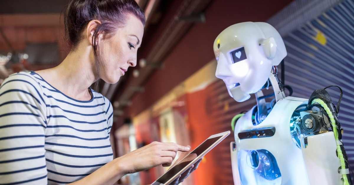 A woman (human) training robot (AI) model. (Representative Cover Image Source: Getty Images | Westend61)