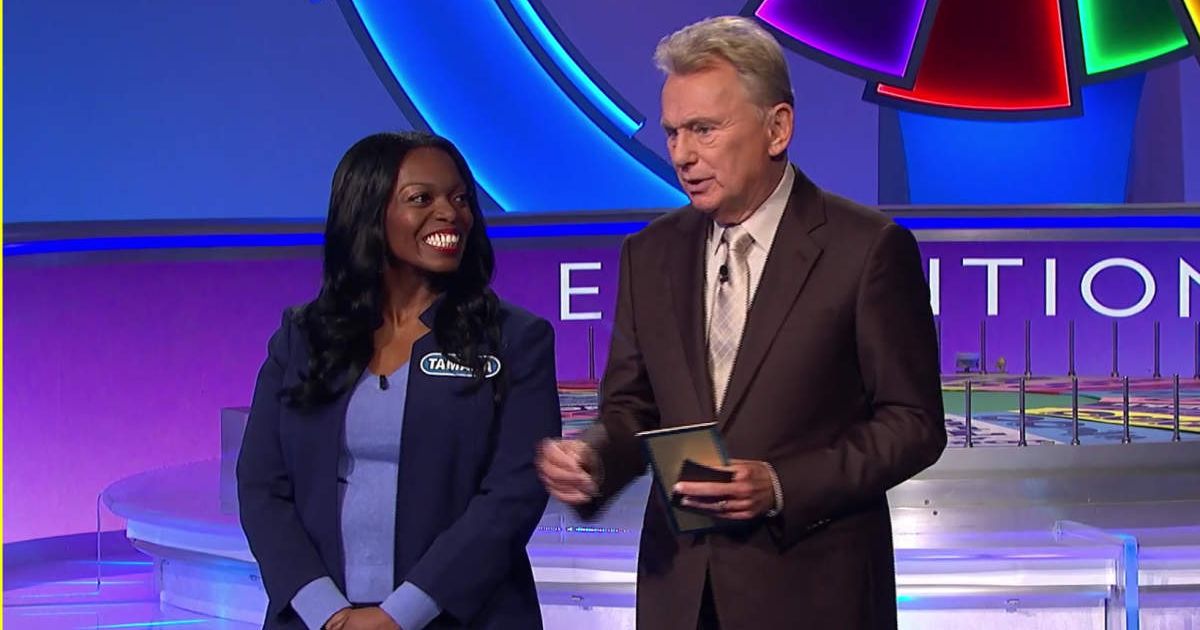 Tamara Atkins and Pat Sajak in a screenshot from 'Wheel of Fortune' (Cover Image Source: YouTube | Wheel of Fortune)