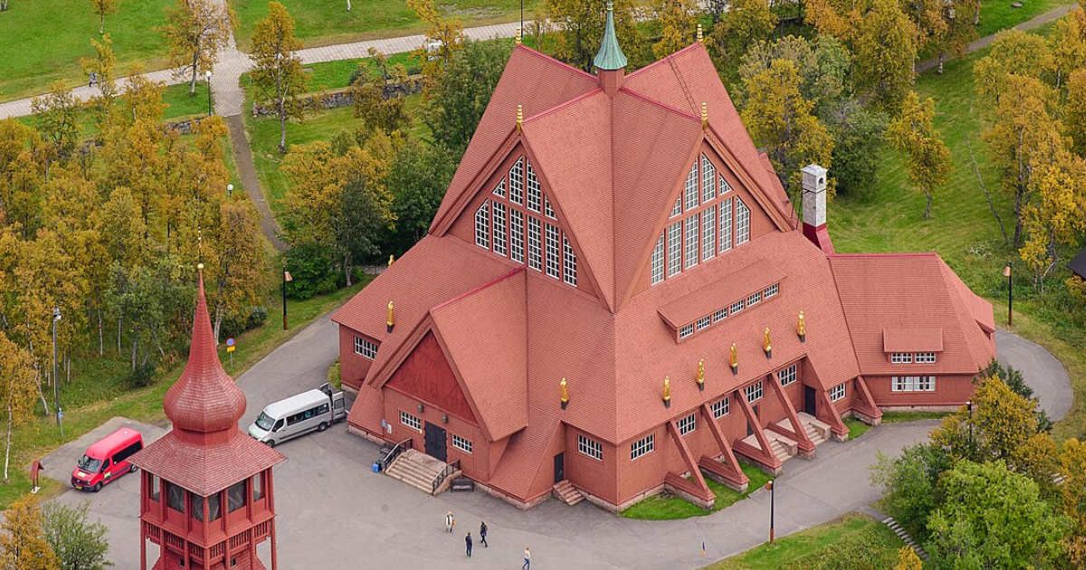 Arial shot of the Kiruna Church (Kiruna Kyrka in Swedish) is one of Sweden's largest wooden buildings, built between 1909-1912. (Representative Cover Image Source: Wikimedia Commons | Photo by Arild Vågen)