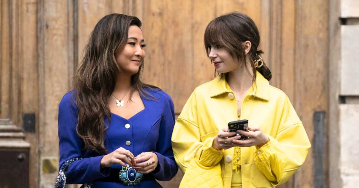 Ashley Park and Lily Collins in a production still from 'Emily in Paris' (Cover Image Source: Netflix | Emily in Paris)