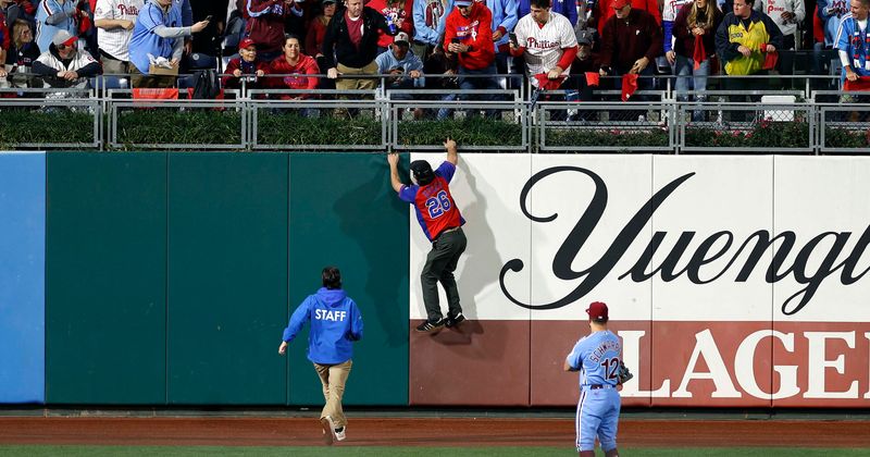 'So unathletic': World Series field invader trolled with 'a*****e' chants amid botched escape attempt