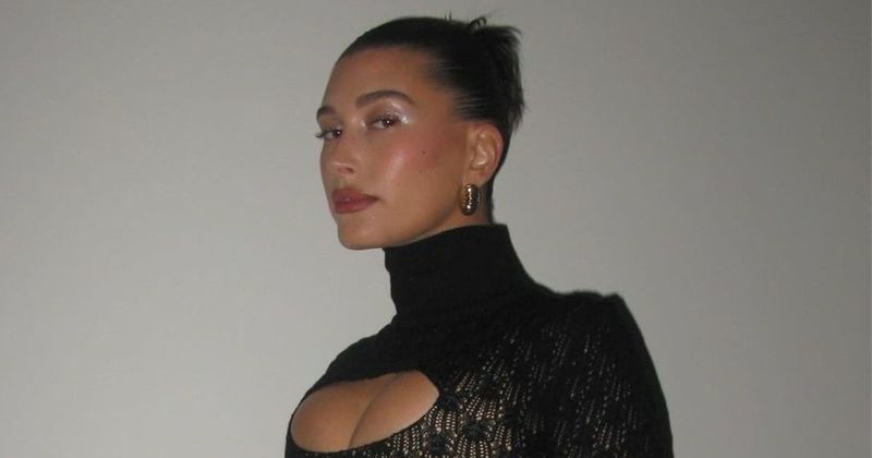 'It's giving evil Xmas tree': Hailey Bieber trolled as she dons red furry coat for Rhode holiday party