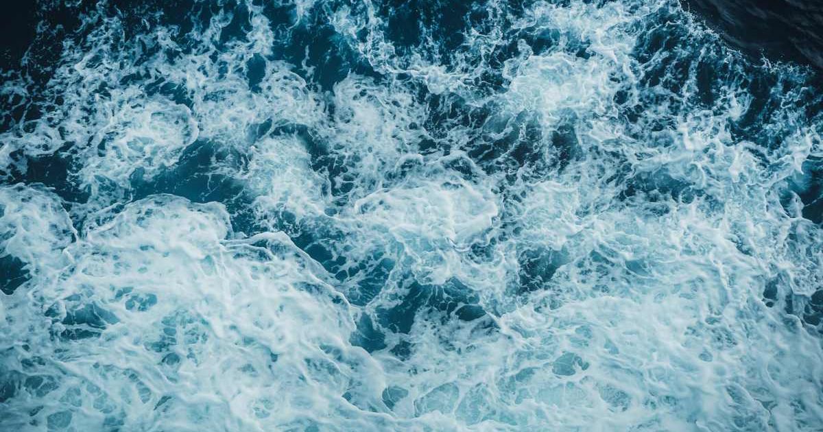 View from above turquoise ocean waves background. (Representative Cover Image Source: Getty Images | Photo by Bignai)
