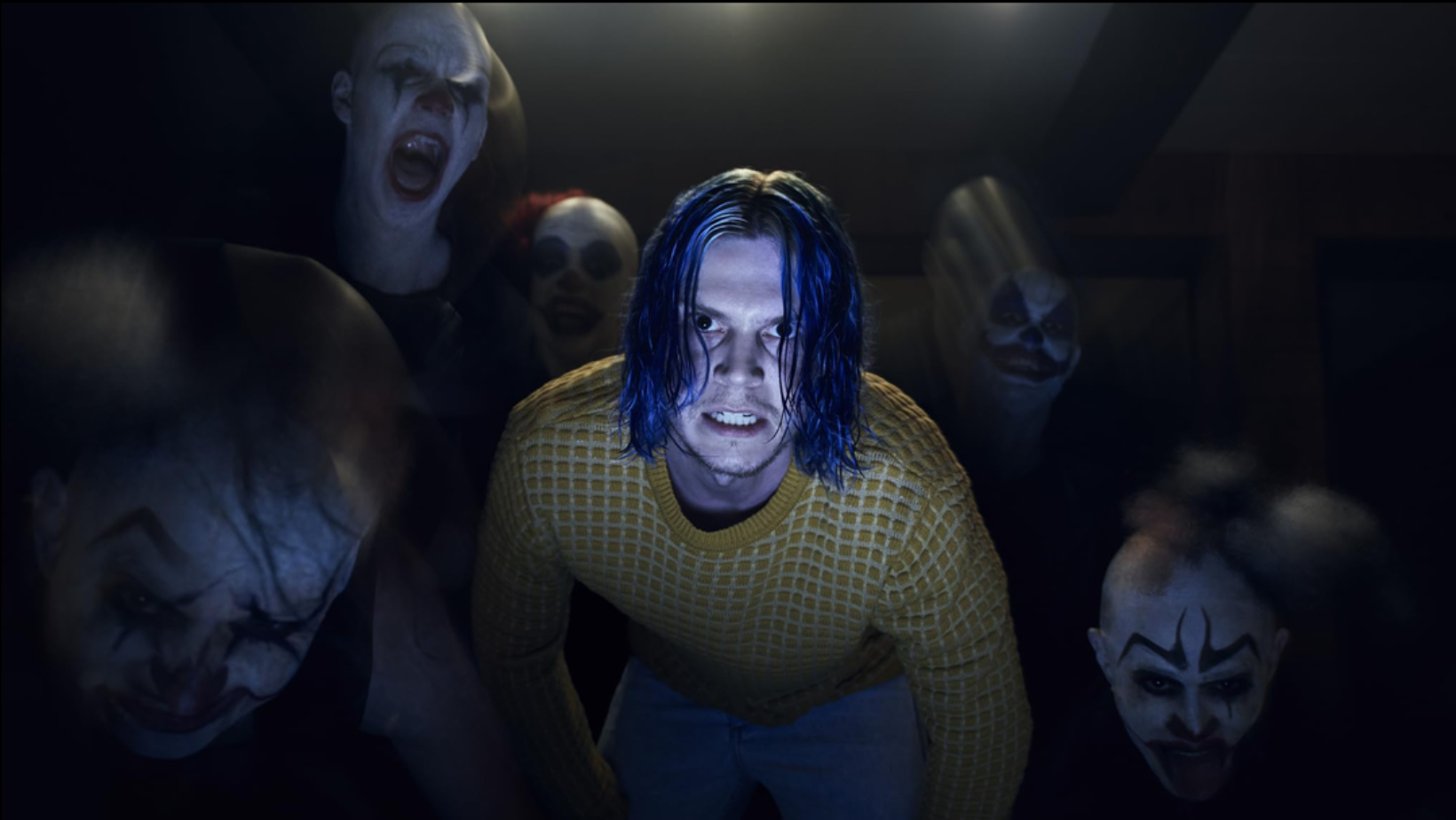 Evan Peters as Kai Anderson surrounded by masked clowns in ‘American Horror Story: Cult’ episode ‘Election Night’ (Image Source: FX Networks)