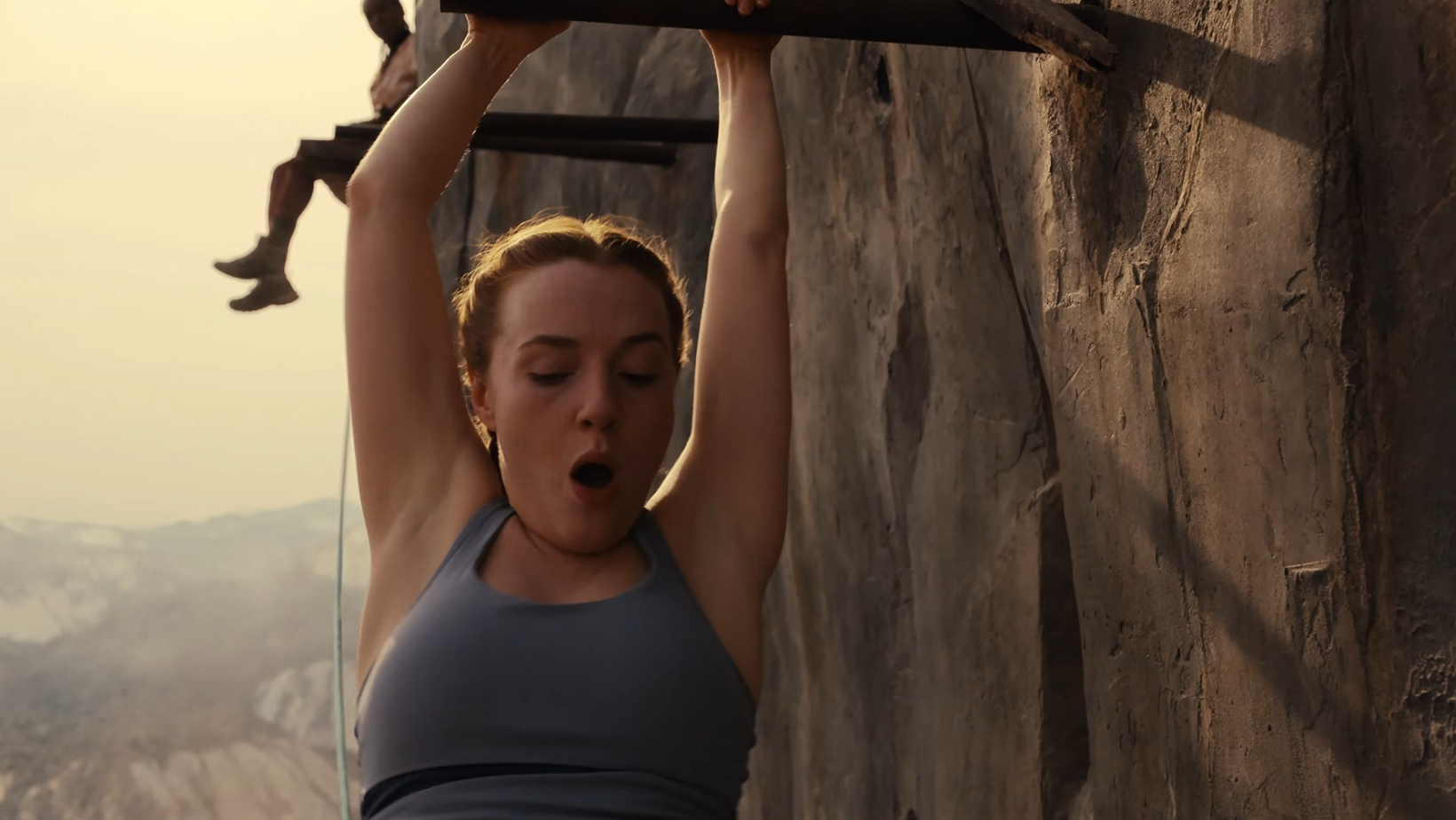 Harriet Slater as Jax Hunter clings to a wooden beam in ‘Fall 2: Deadpoint’ (Image Source: YouTube | Lionsgate Movies)