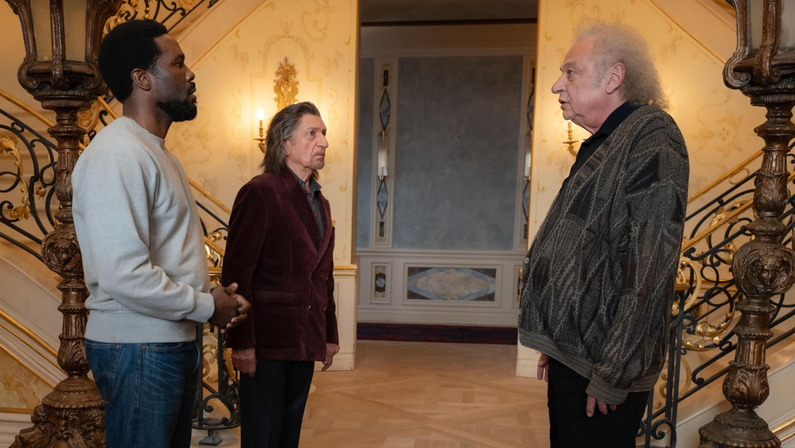 Yahya Abdul-Mateen II as Simon Williams and Ben Kingsley as Trevor Slattery meet Zlatko Burić’s director Von Kovak in ‘Wonder Man’ (Image Source: Marvel Television | Disney+)