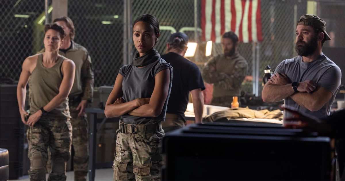 Thad Luckinbill, Zoe Saldaña, Jill Wagner, James Jordan, Austin Hébert, and Jonah Wharton in a still from 'Lioness'