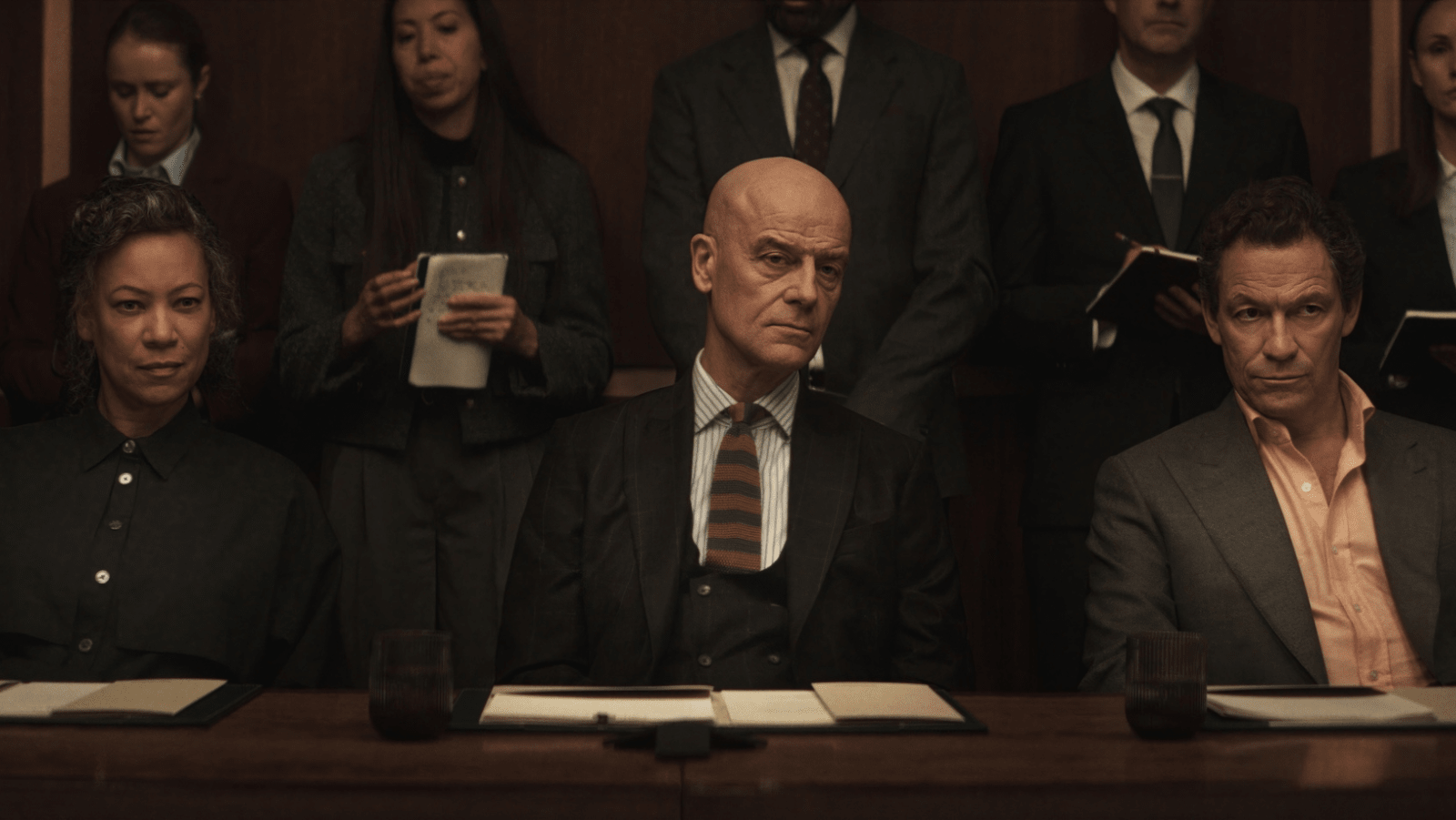 Nina Sosanya as Beatrice “Queen Bea” Ubosi, Pip Torrens as St John Smallwood and Dominic West as Morgan Henderson in ‘War’ (Image Source: HBO)