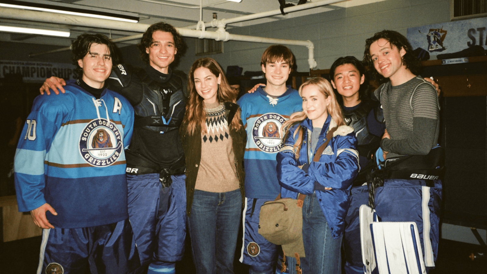 (L to R) Callum Orchison, Costa D’Angelo, Michelle Monaghan, Shai Chase, Émilie Bierre, Ethan Holder and Carter Shimp on the set of ‘The Sticks.’  (Image source: Netflix)