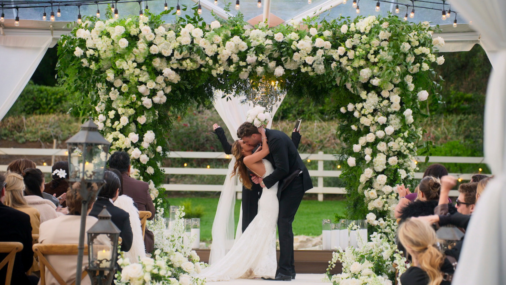 Harry Jowsey and Amber Mozo exchange a kiss during their wedding in 'Let's Marry Harry' (Image Source: Netflix)