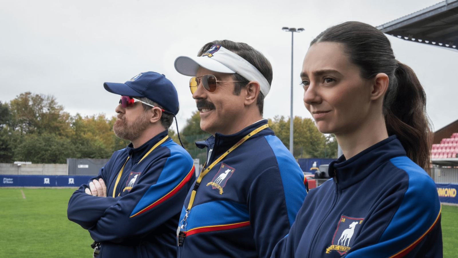 Brendan Hunt as Coach Beard, Jason Sudeikis as Ted Lasso and Tanya Reynolds as Coach Alice Chilton in ‘Ted Lasso’ Season 4 (Image Source: Apple TV)
