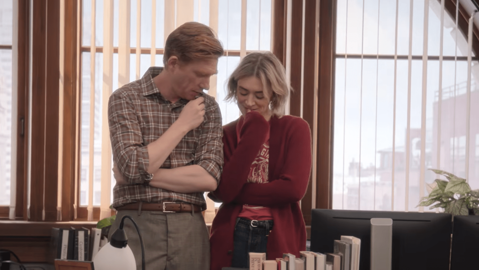 Domhnall Gleeson as Ned Sampson and Chelsea Frei as Mare Pritti share a moment in ‘The Paper’ Season 2 (Image Source: YouTube | Peacock)