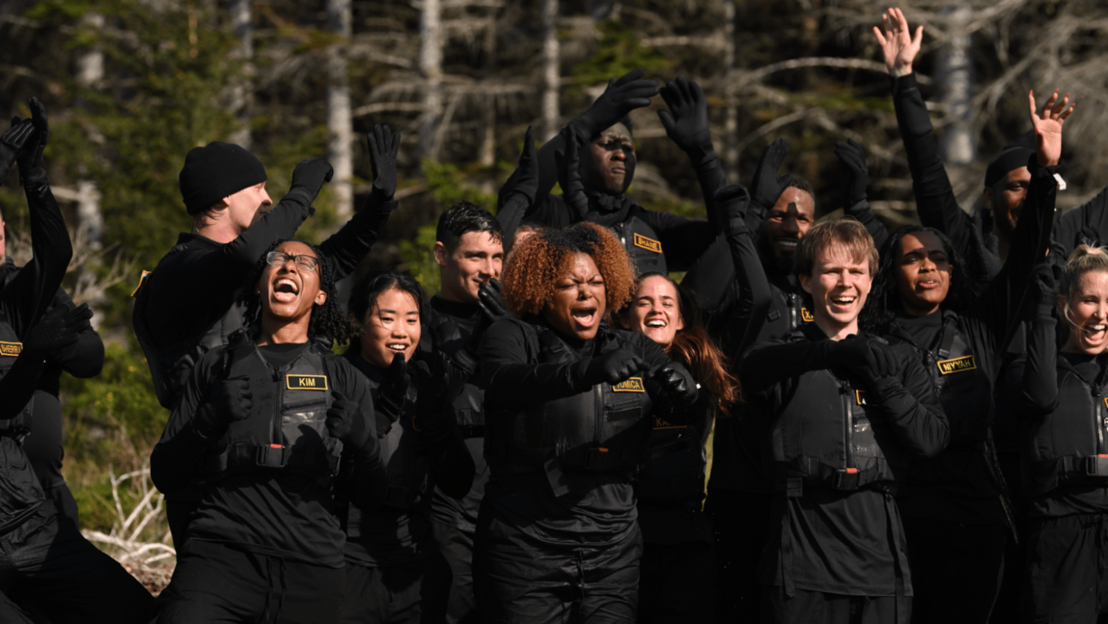 Contestants celebrate during a challenge in ‘The Traitors: New Blood’ (Image Source: NBC | Photo by Euan Cherry)