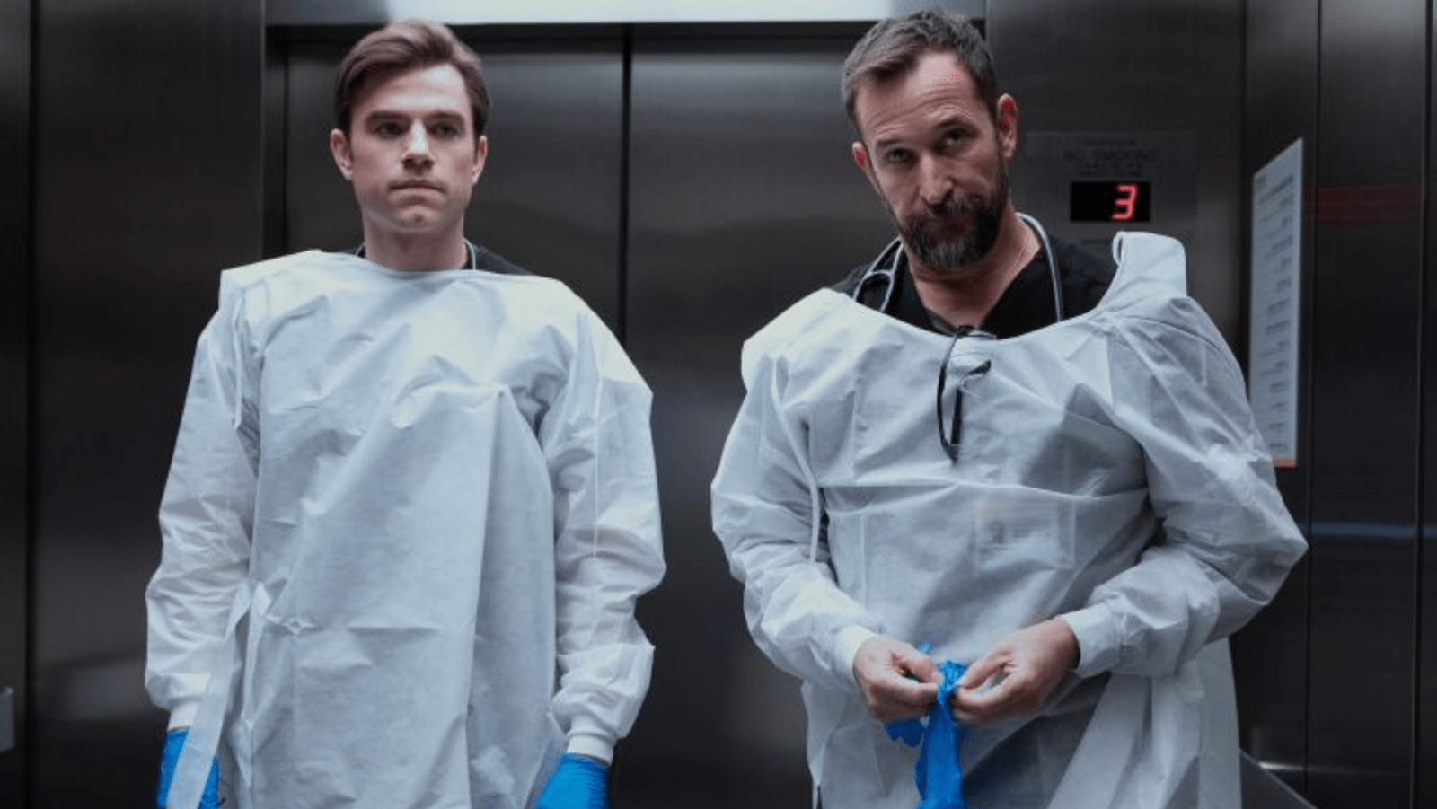Patrick Ball as Dr. Langdon and Noah Wyle as Dr. Robby prepare for a medical procedure in ‘The Pitt’ (Image Source: HBO)