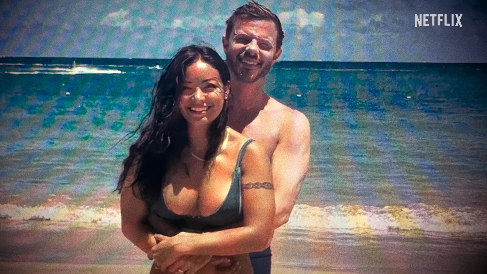 Mica Miller and John-Paul Miller pose together on a beach in ‘Death of the Pastor’s Wife’ (Image Source: Netflix)