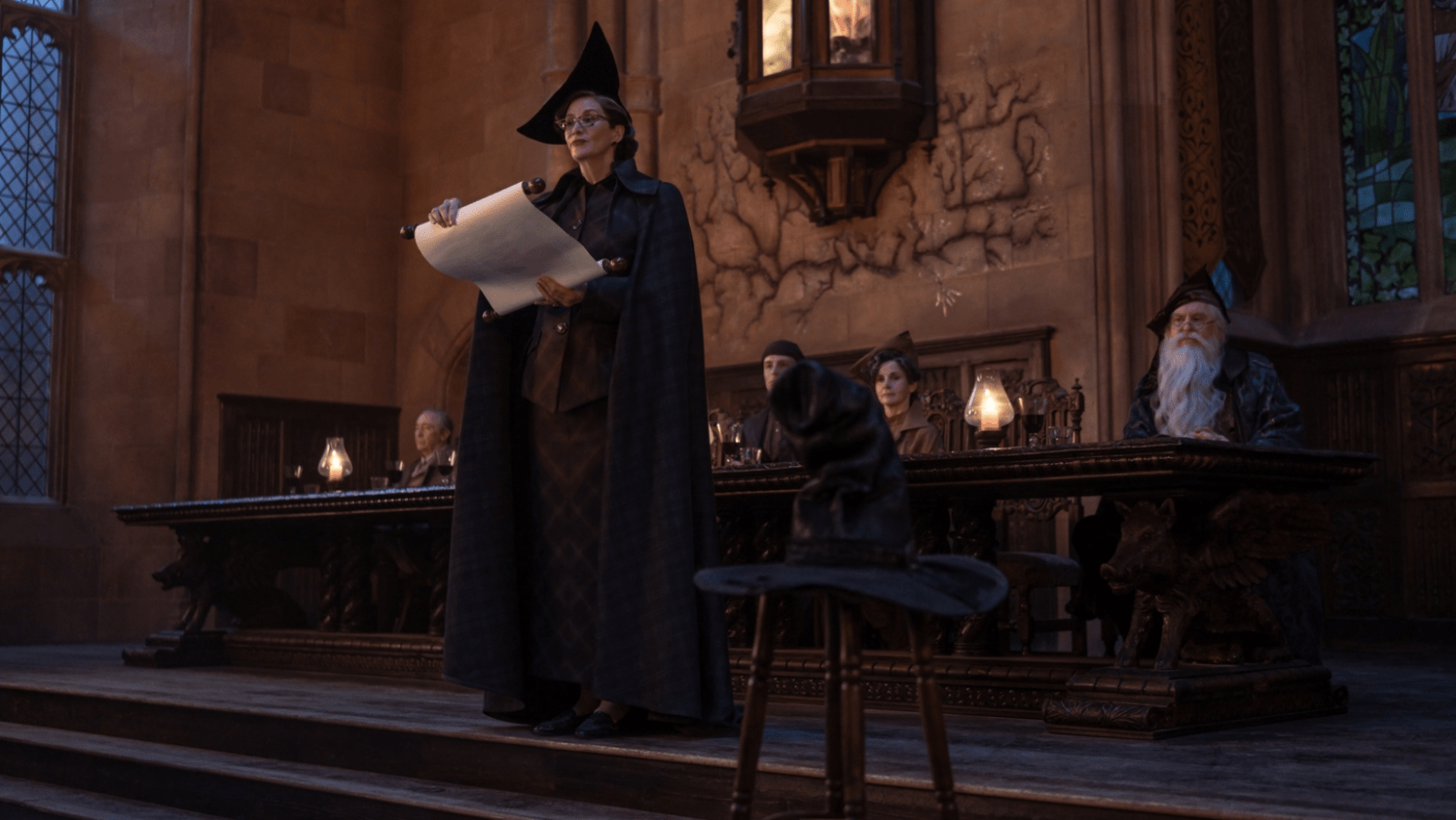 Janet McTeer as Professor McGonagall stands beside the Sorting Hat during the Sorting Ceremony in ‘Harry Potter and the Philosopher’s Stone’ (Image Source: HBO)