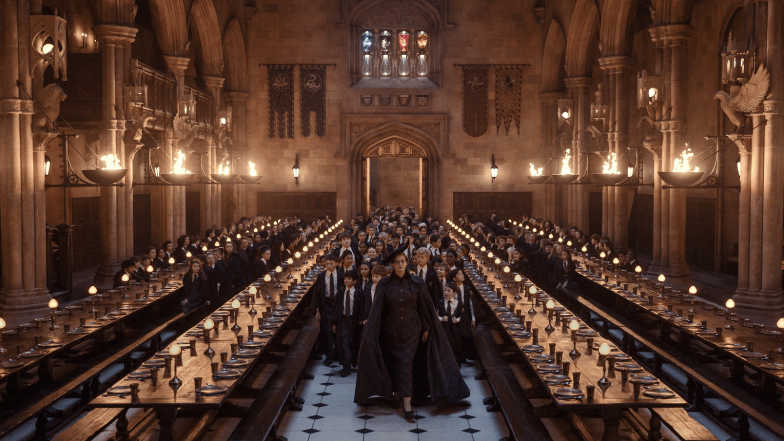 Janet McTeer as Professor McGonagall leads the students through Hogwarts’ Great Hall in ‘Harry Potter and the Philosopher’s Stone’ (Image Source: HBO)