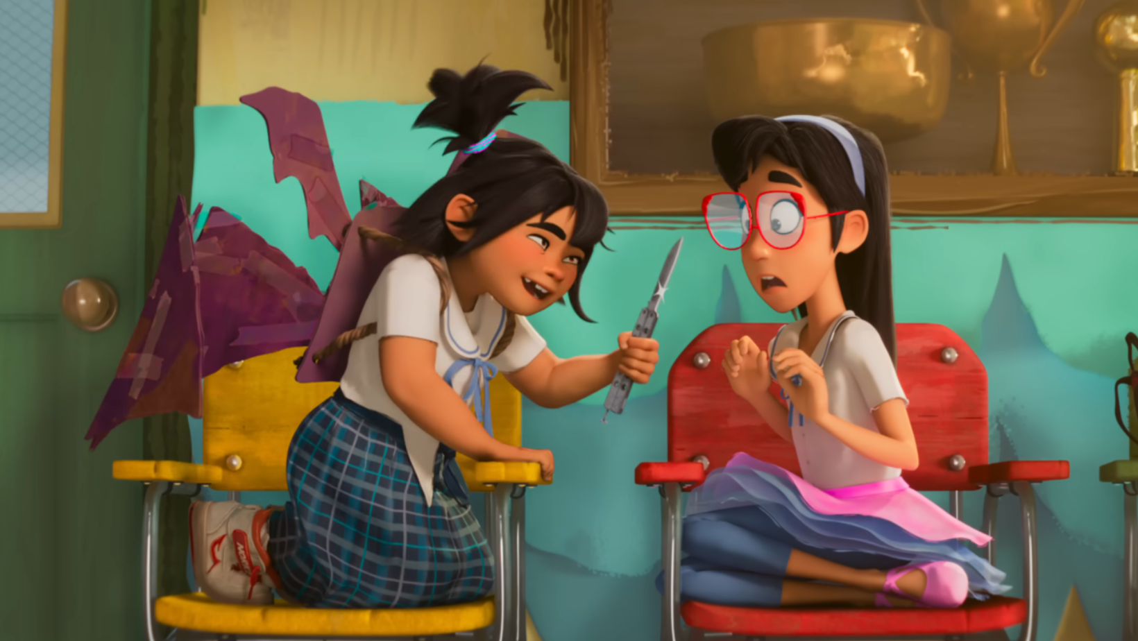 A still from the trailer of ‘Forgotten Island’ showing Jo holding a small blade while Raissa watches (Image Source: YouTube | Universal Pictures)