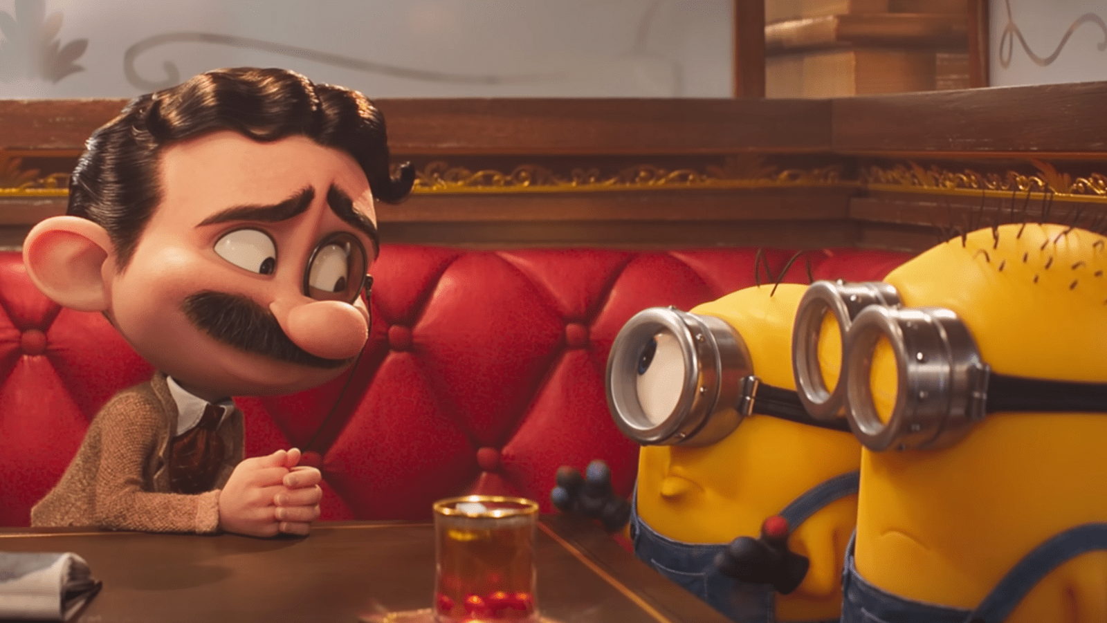 James (L) and Henry (R) meet a film industry figure in ‘Minions & Monsters’ (Image Source: Illumination/Universal Pictures)