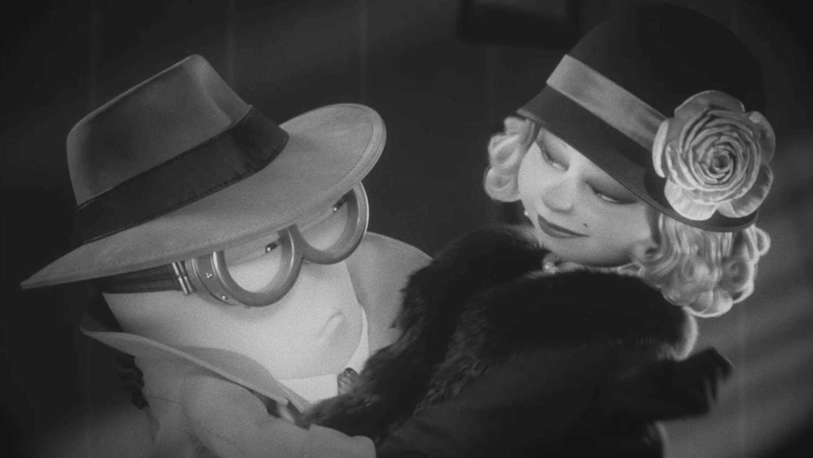 A Minion appears in a black-and-white Hollywood scene in ‘Minions & Monsters’ (Image Source: Illumination/Universal Pictures)