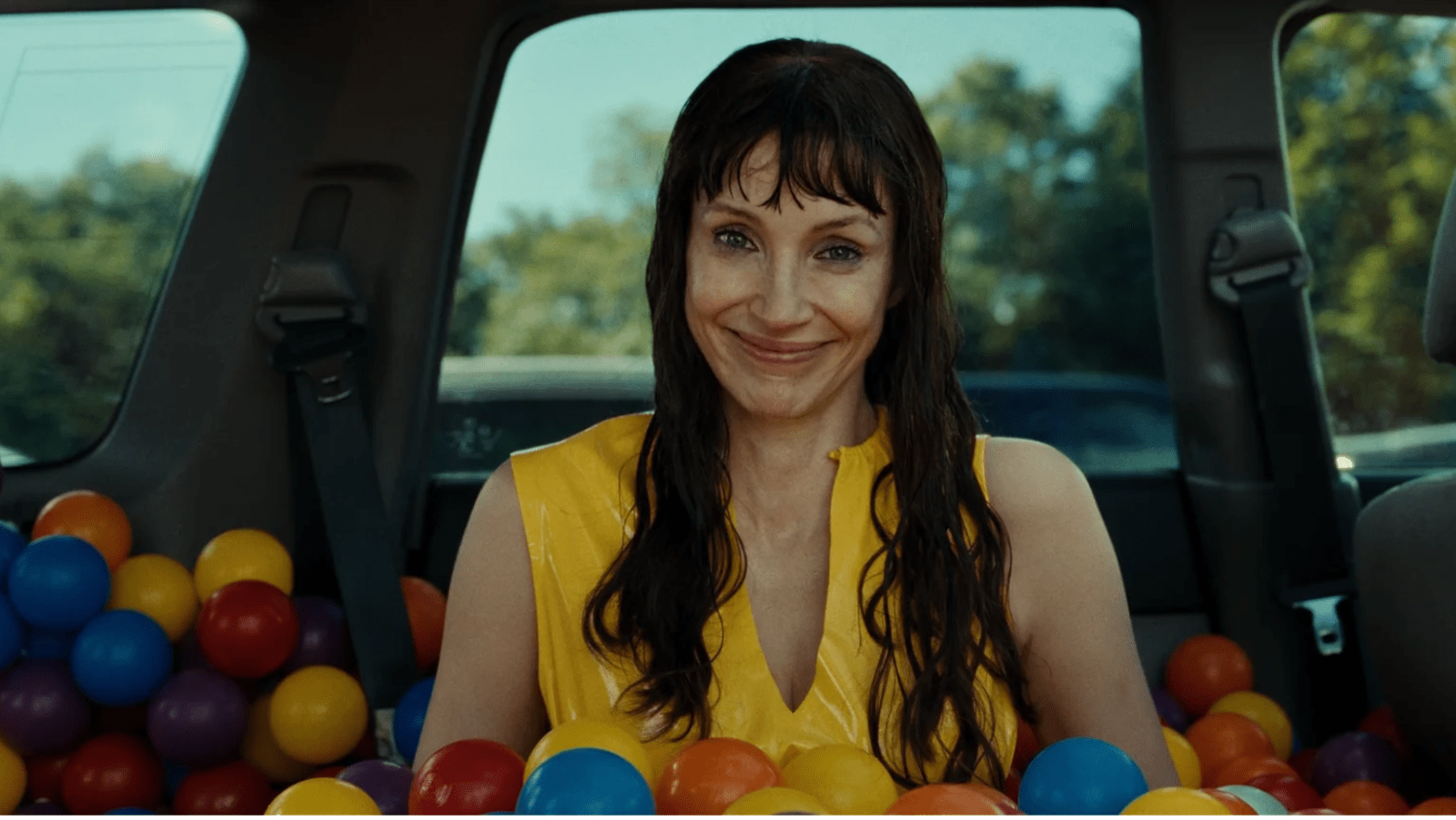 Other Mommy appears as Ursula in a car filled with ball pit balls in 'Other Mommy' (Image Source: Universal Pictures)
