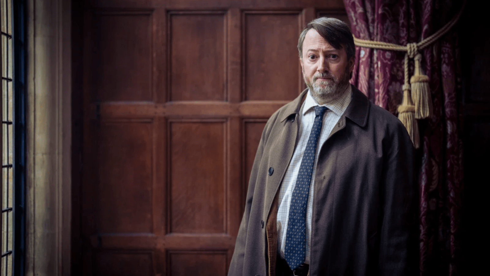 David Mitchell returns as John Taylor in ‘Ludwig’ Season 2, streaming on BritBox (Image Source: BritBox)