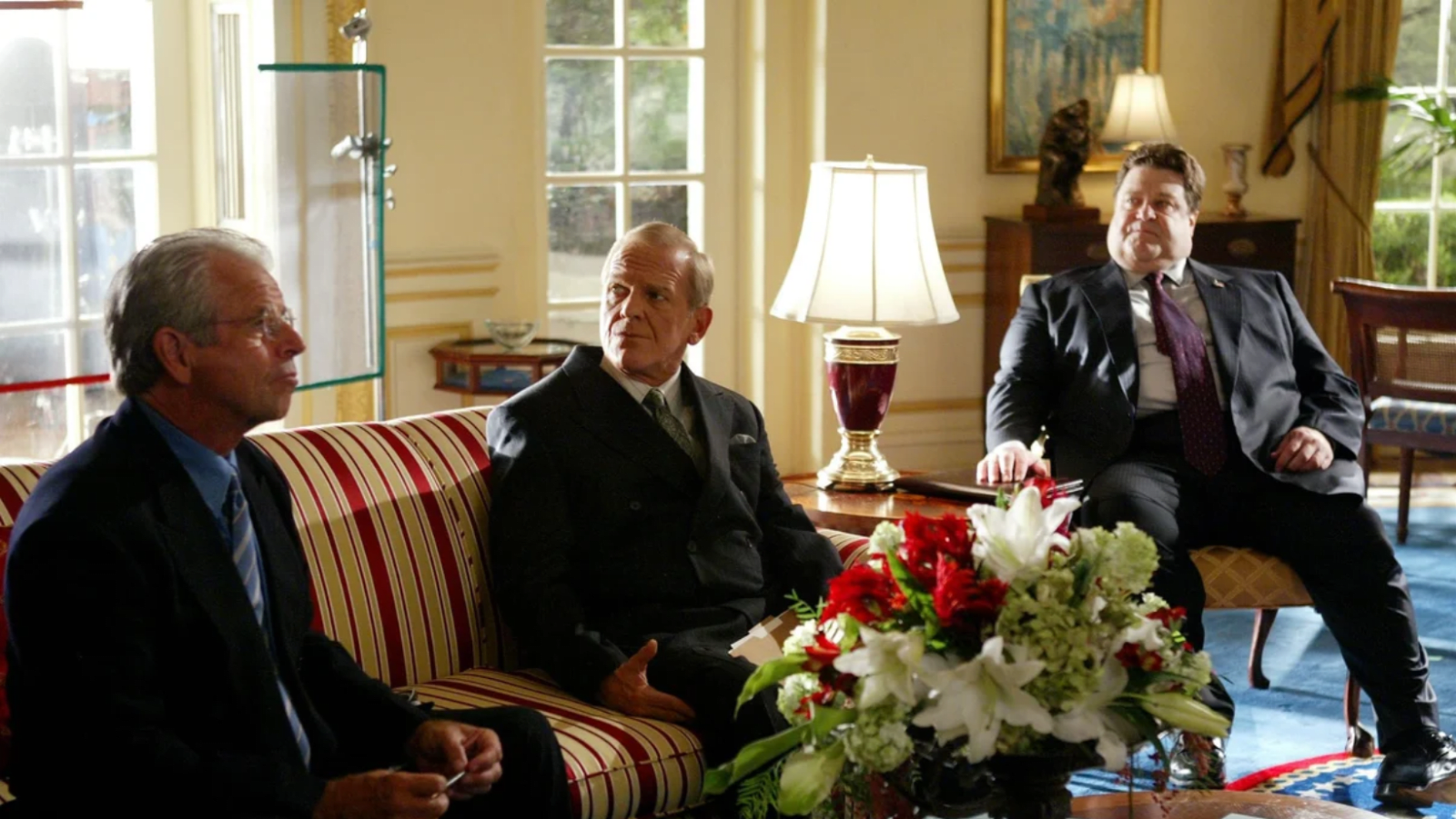 William Devane (L), John Spencer (C) and John Goodman (R) in a scene from 'The West Wing' (Image source: Warner Bros Pictures)